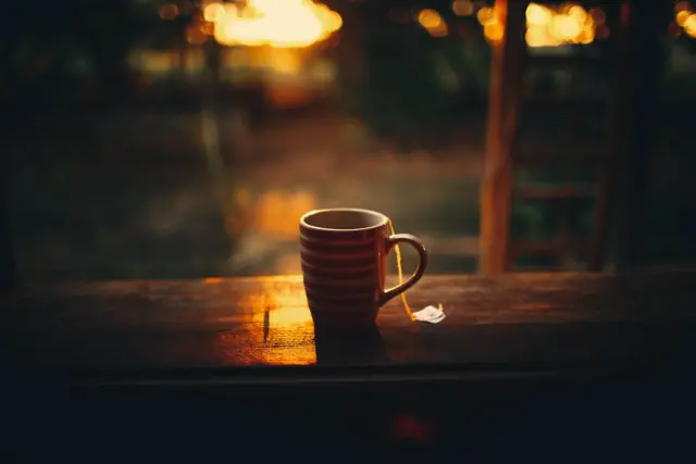 Morning coffee on a balcony overlooking nature